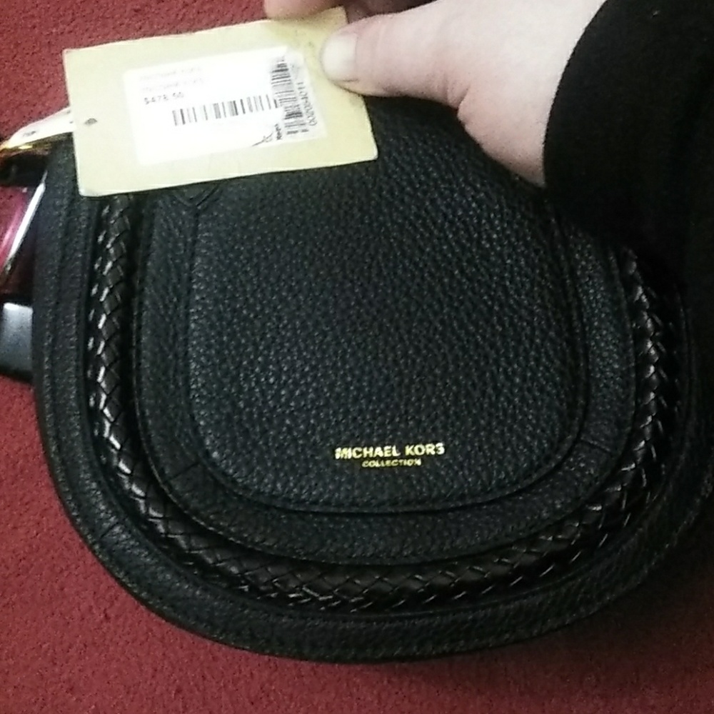 A brand new Michael kors purse slash side bag